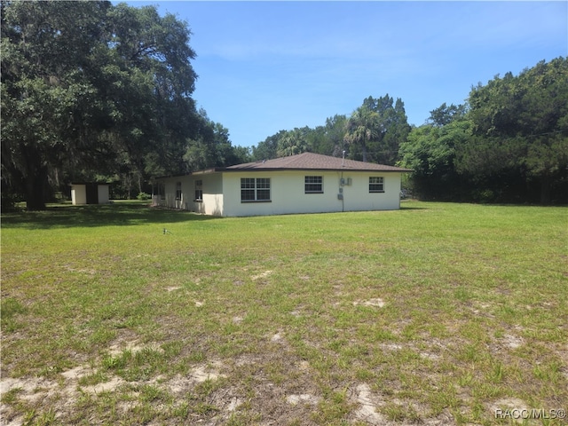 7781 N Lazy Trl, Crystal River, FL 34428 - back of house with a yard