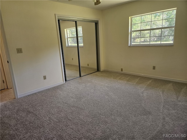 7781 N Lazy Trl, Crystal River, FL 34428 - unfurnished bedroom featuring carpet flooring, baseboards, and a closet