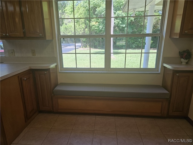 7781 N Lazy Trl, Crystal River, FL 34428 - kitchen with healthy amount of natural light, light countertops, and light tile patterned floors
