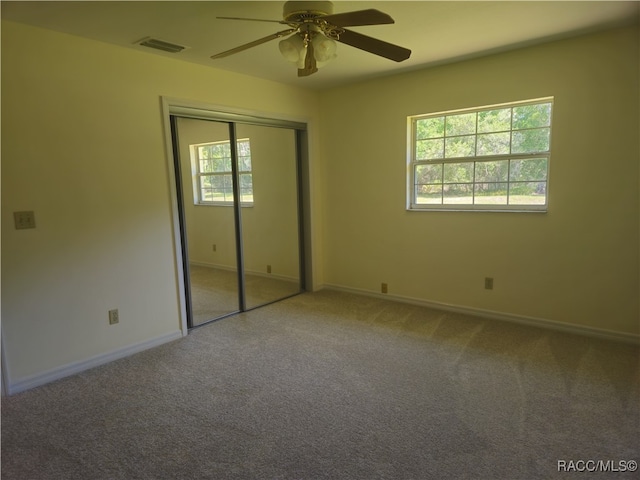 7781 N Lazy Trl, Crystal River, FL 34428 - unfurnished bedroom with carpet floors, a closet, baseboards, and ceiling fan