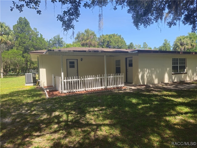 7781 N Lazy Trl, Crystal River, FL 34428 - view of front of property with stucco siding and cooling unit