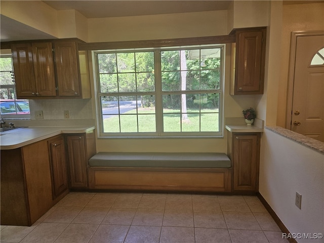 7781 N Lazy Trl, Crystal River, FL 34428 - kitchen with light countertops, plenty of natural light, and light tile patterned floors
