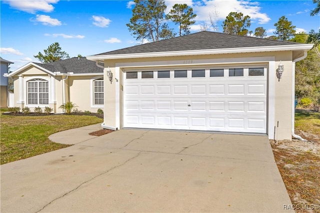 ranch-style home with a garage and a front lawn