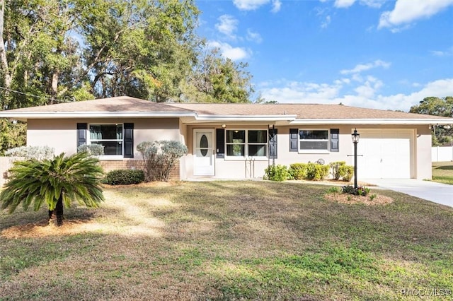 single story home featuring a garage and a front yard