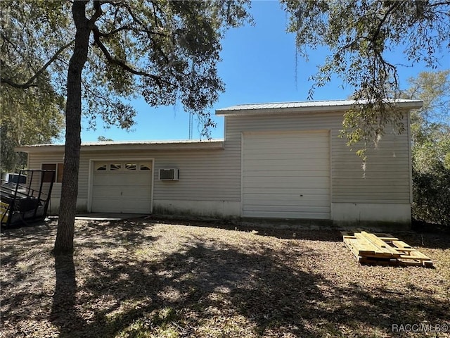 garage featuring an AC wall unit