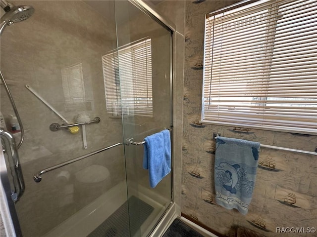 full bath with a shower stall