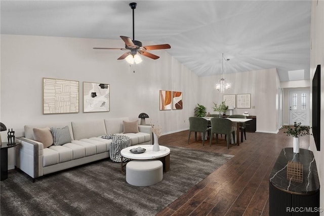 living room with dark hardwood / wood-style flooring, ceiling fan with notable chandelier, and lofted ceiling