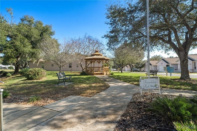 view of community with a yard and a gazebo