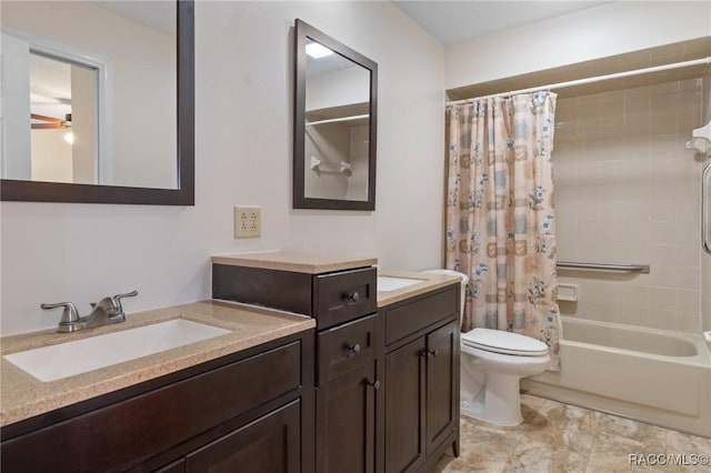 full bathroom featuring vanity, shower / bath combination with curtain, and toilet