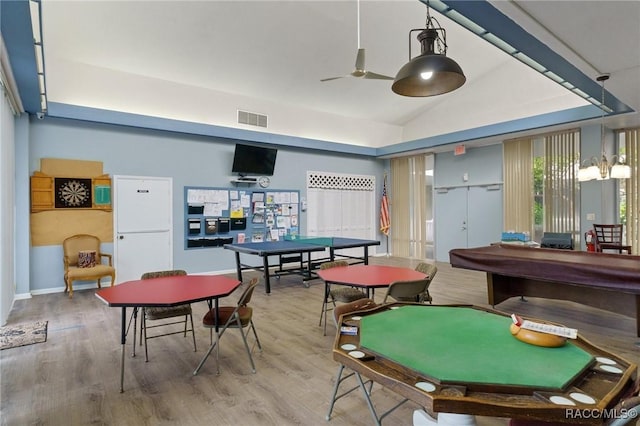 game room featuring lofted ceiling, hardwood / wood-style floors, and ceiling fan