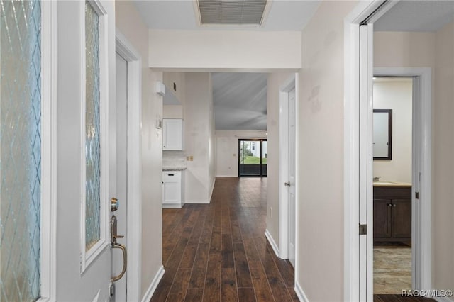 hall with dark hardwood / wood-style flooring and sink