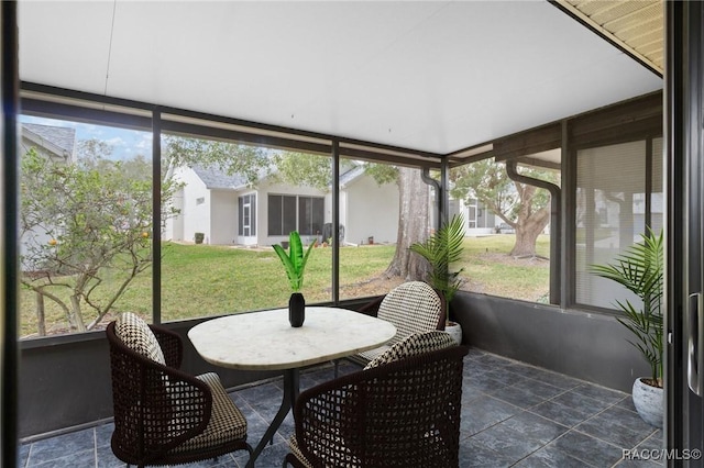 sunroom / solarium featuring a wealth of natural light