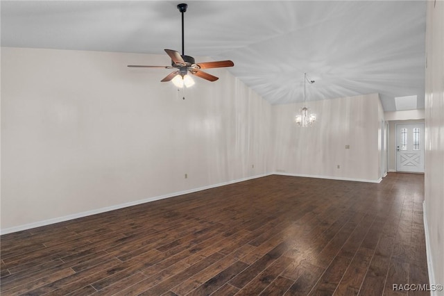 empty room featuring dark wood-type flooring, vaulted ceiling, and ceiling fan with notable chandelier