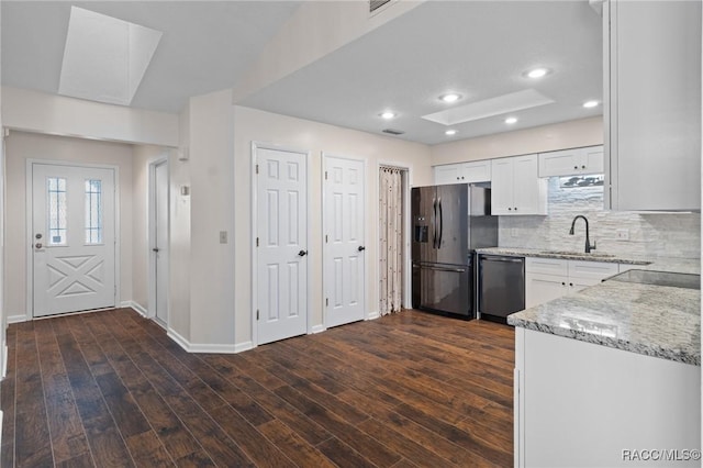 kitchen featuring dark hardwood / wood-style flooring, sink, white cabinets, and appliances with stainless steel finishes