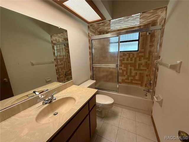 2098 W Deer Trail Ln, Lecanto, FL 34461 - bathroom with tile patterned floors, combined bath / shower with glass door, toilet, and vanity