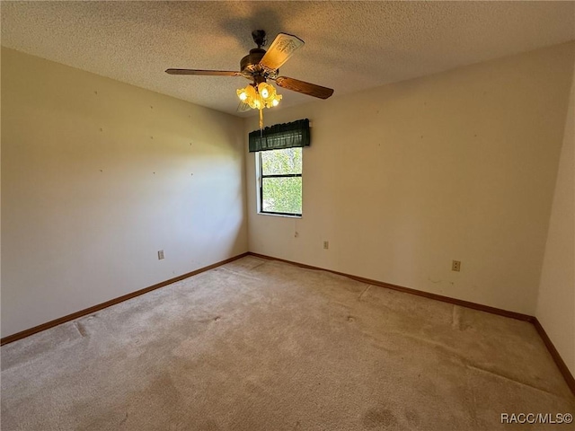 2098 W Deer Trail Ln, Lecanto, FL 34461 - empty room featuring light carpet, baseboards, ceiling fan, and a textured ceiling