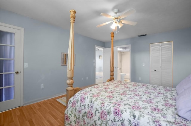 bedroom featuring visible vents, baseboards, light wood-style flooring, ceiling fan, and ensuite bathroom