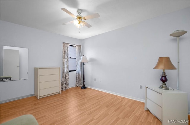 bedroom featuring light wood-type flooring, baseboards, and a ceiling fan