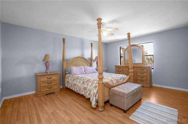 bedroom featuring light wood-type flooring, baseboards, and a ceiling fan