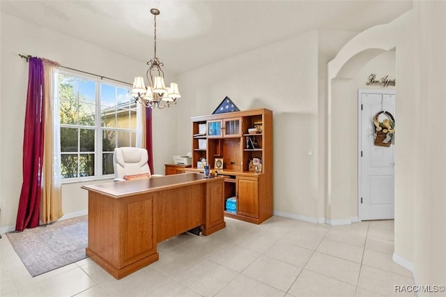 home office with light tile patterned flooring, baseboards, and an inviting chandelier