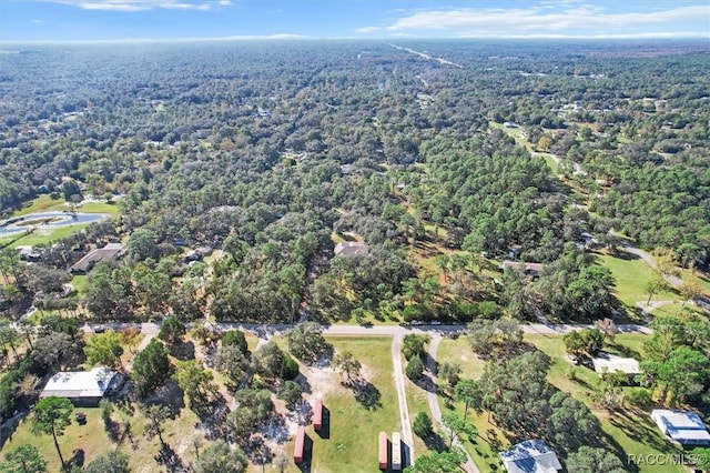 aerial view featuring a view of trees