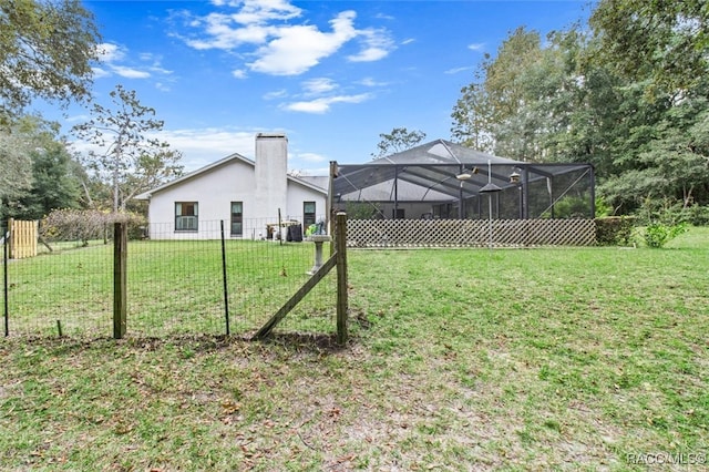 view of yard with a lanai