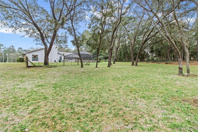 view of yard featuring a lanai