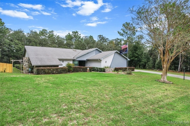 view of side of property with a lawn