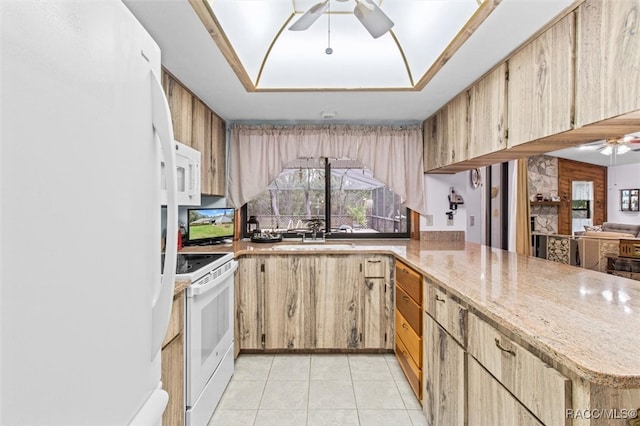 kitchen featuring kitchen peninsula, light brown cabinets, light tile patterned floors, and white appliances