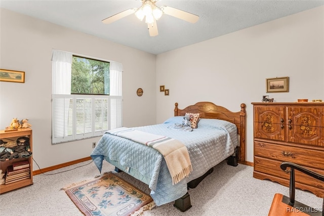 bedroom featuring light carpet and ceiling fan