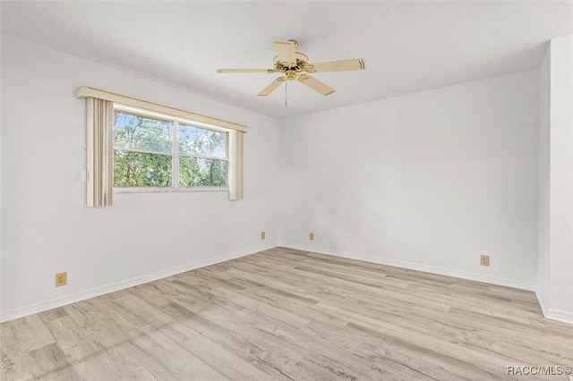 unfurnished room with ceiling fan and light hardwood / wood-style floors