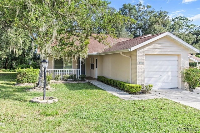 single story home with a front yard, a porch, and a garage