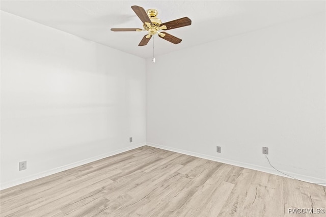 spare room with ceiling fan and light hardwood / wood-style flooring