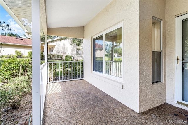 view of patio with a balcony