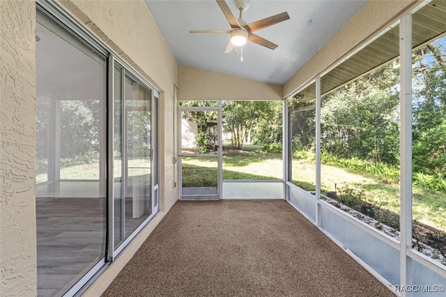 unfurnished sunroom featuring ceiling fan and lofted ceiling