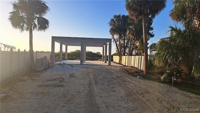 exterior space with a pergola and fence