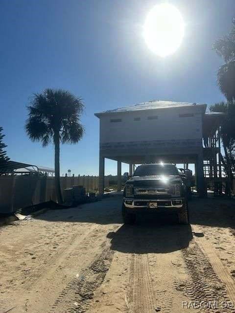 view of parking / parking lot with a carport