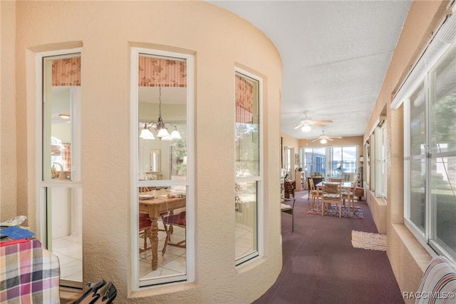 sunroom with an inviting chandelier