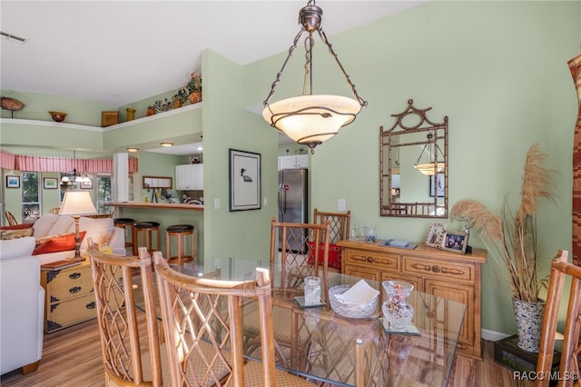 dining area with light hardwood / wood-style flooring