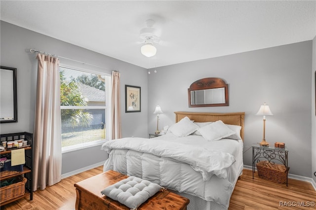 bedroom featuring ceiling fan and light hardwood / wood-style flooring