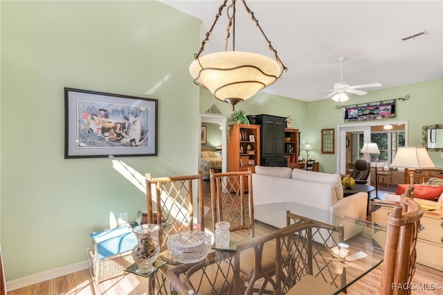 dining area featuring ceiling fan and light hardwood / wood-style flooring