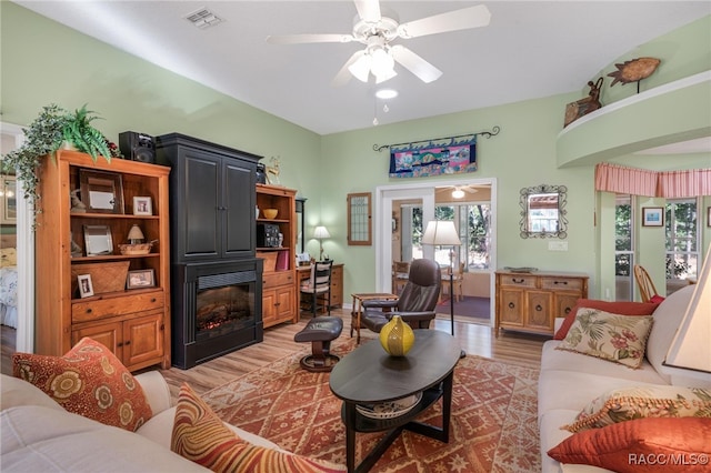 living room featuring hardwood / wood-style flooring and ceiling fan