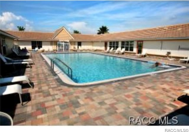 view of swimming pool featuring a patio