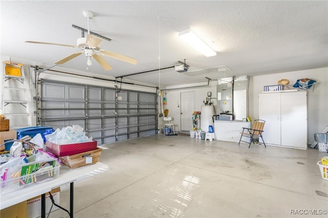 garage with heating unit, a garage door opener, and ceiling fan