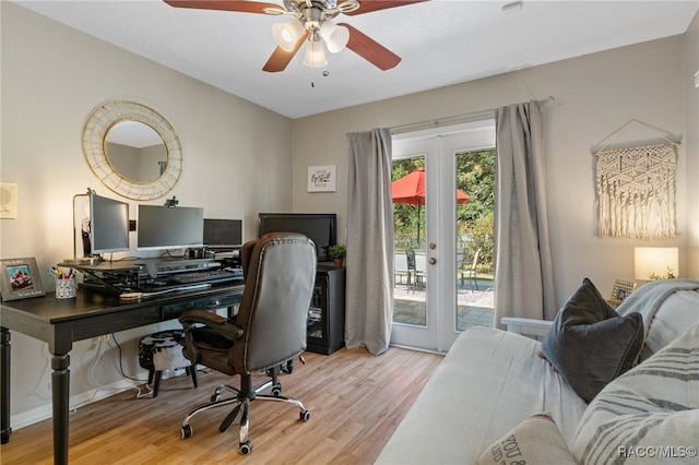 home office with ceiling fan, light hardwood / wood-style floors, and french doors