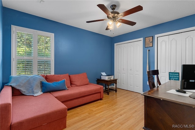 office area with ceiling fan and light wood-type flooring