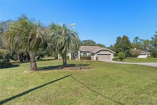 single story home featuring a front yard and a garage