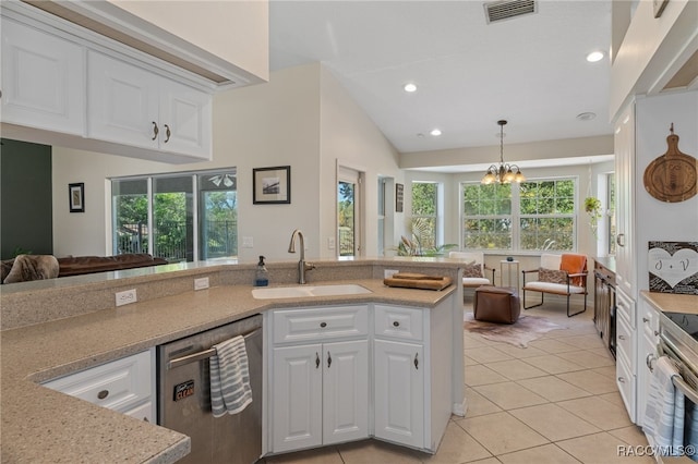 kitchen featuring sink, light tile patterned flooring, vaulted ceiling, white cabinets, and appliances with stainless steel finishes