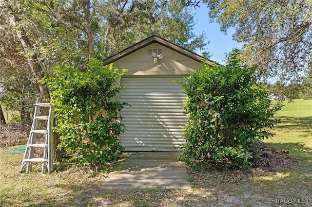 view of side of property featuring an outbuilding