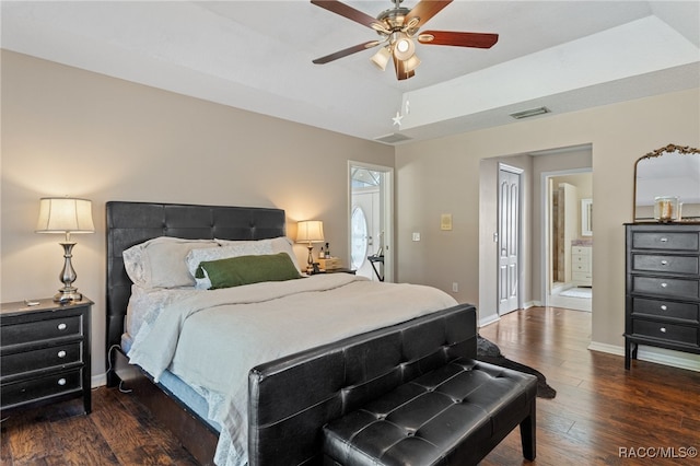 bedroom with dark hardwood / wood-style floors and ceiling fan